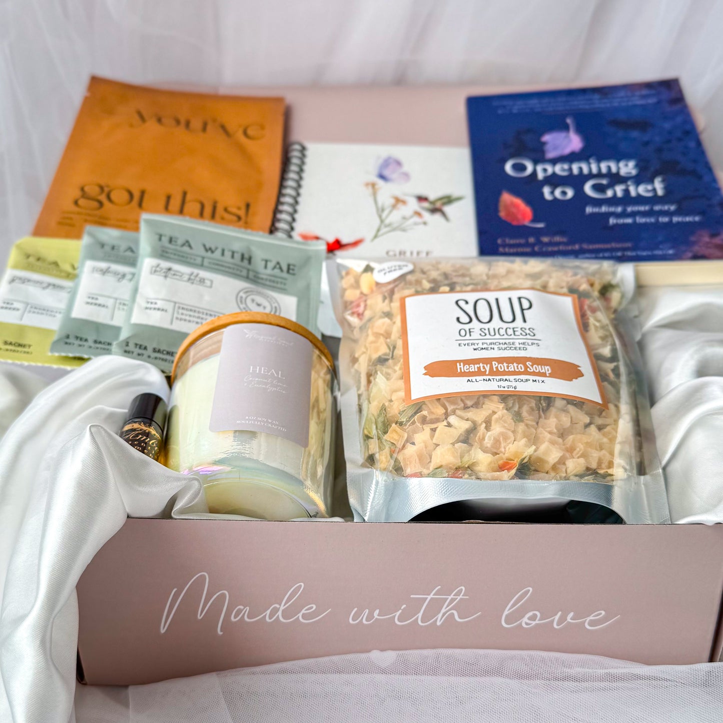 comfort gift box for grieving friend with candle journal and tea