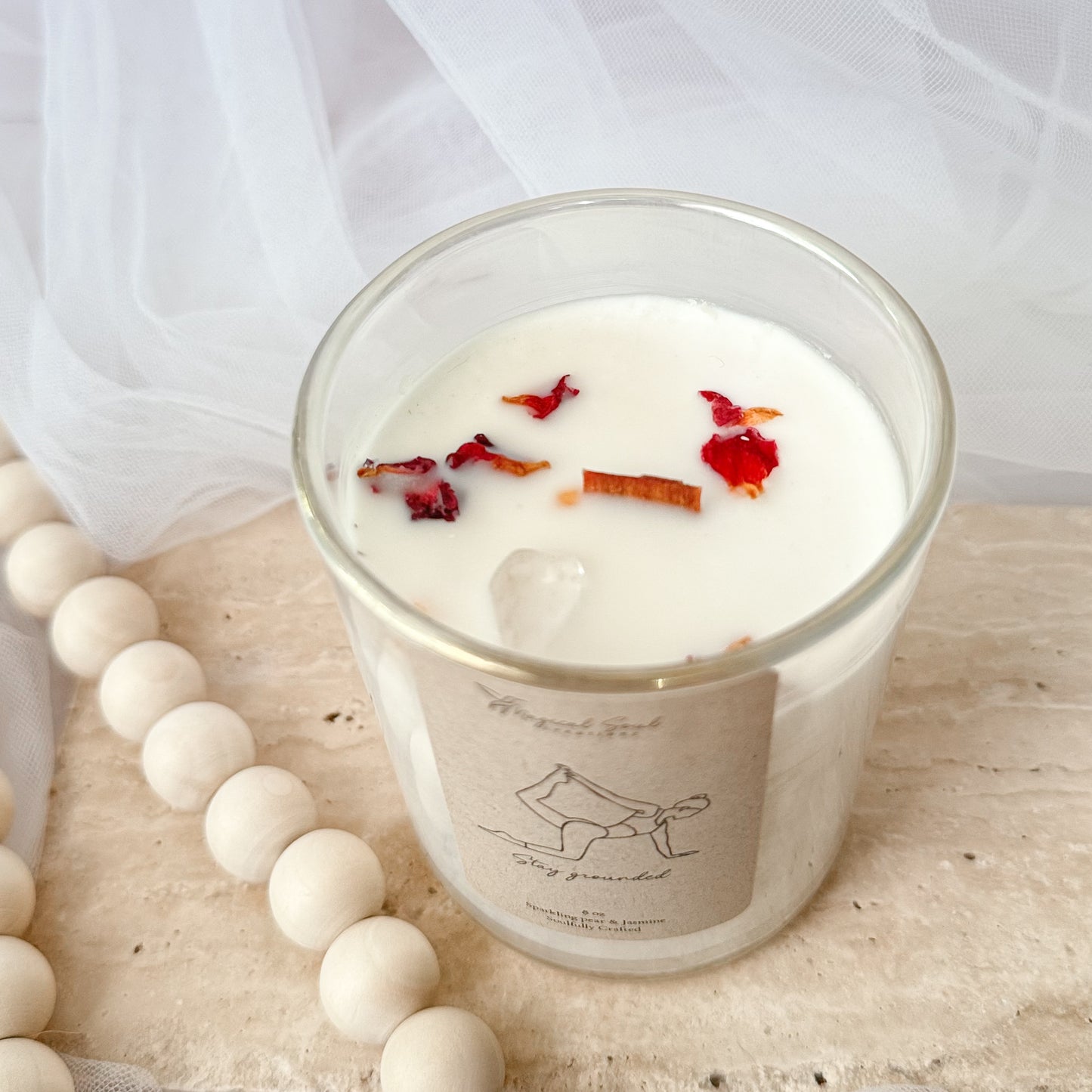 luxury soy candle with clear quartz and dried rose petals