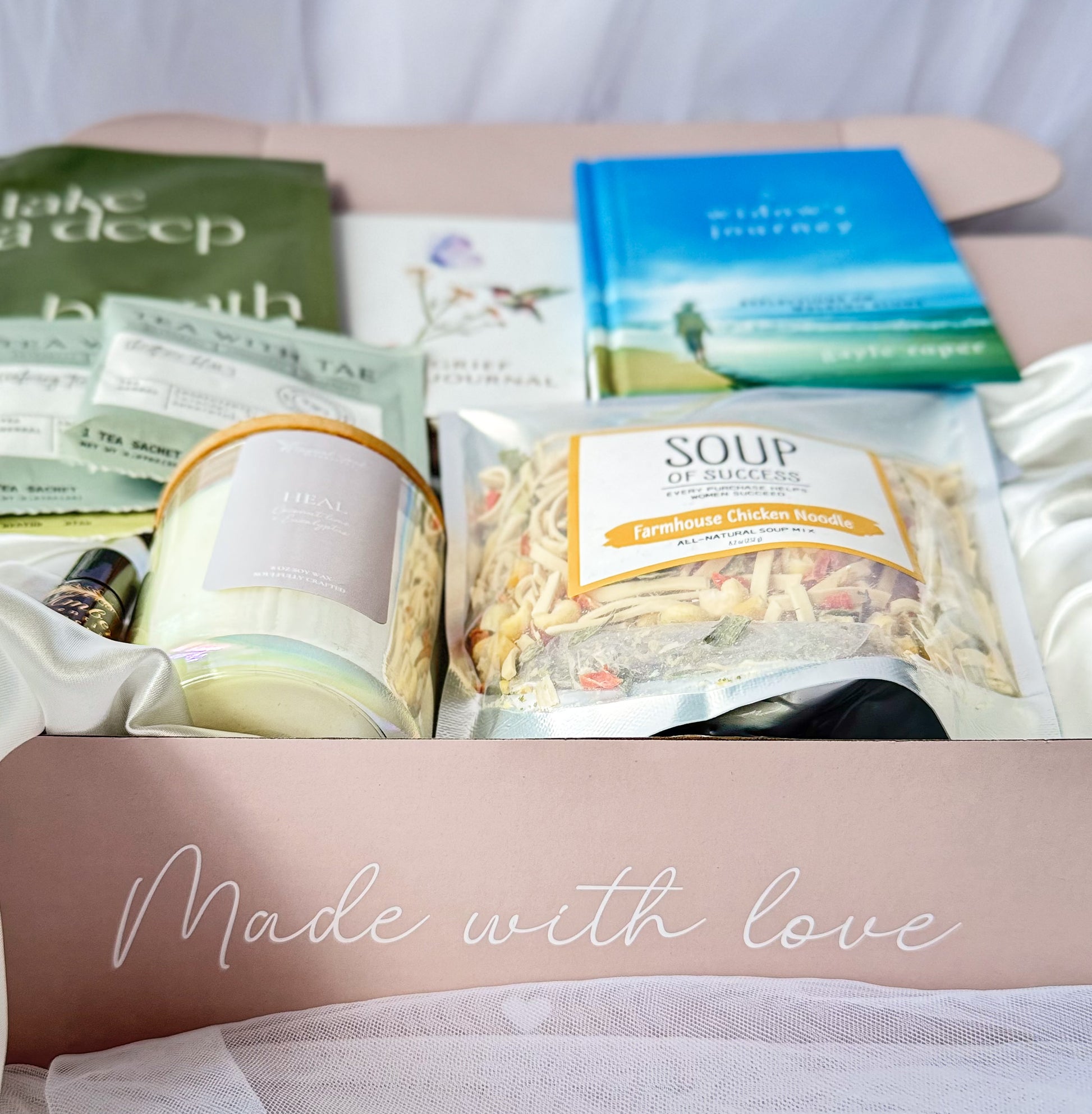sympathy gift for widow with candle journal and wellness items